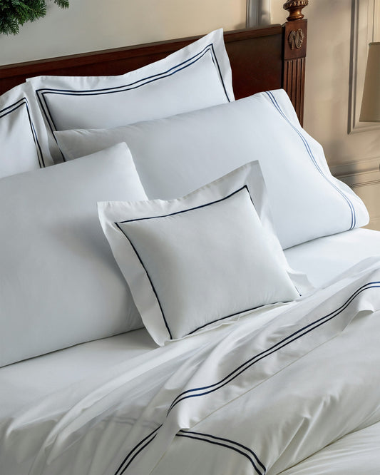 Decorative Pillow in White with Navy Piping